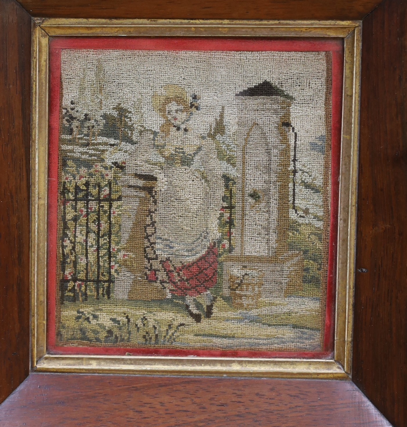 A late 19th century sample by Eliza Wood, aged 10, dated 1882, 43 x 40cm, together with a smaller glazed frame needlework panel of a lady leaning